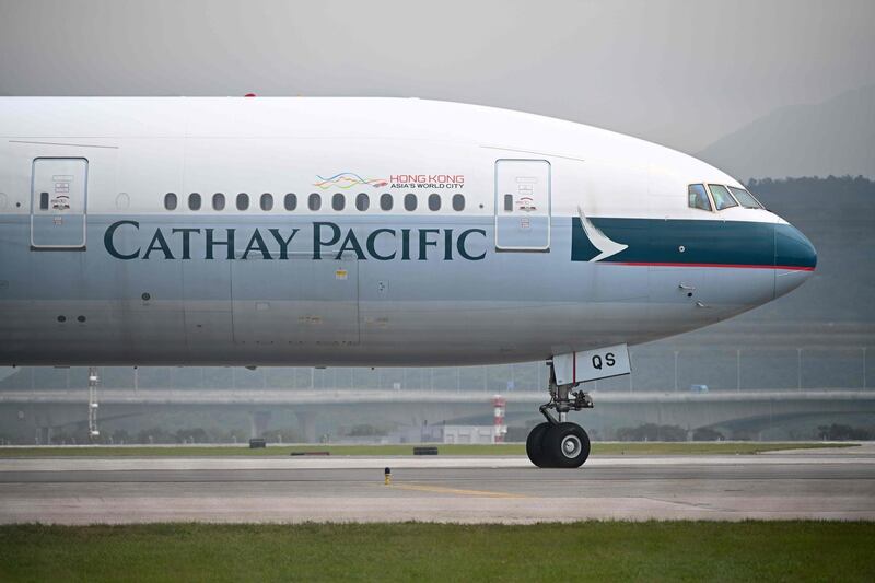 (FILES) This file photo taken on March 13, 2019 shows a Cathay Pacific passenger plane preparing to take off from Hong Kong's international airport. Troubled Hong Kong carrier Cathay Pacific said it lost 1.27 billion USD in the first half of this year, the latest major airline to reveal how badly the COVID-19 coronavirus pandemic has eviscerated its business. / AFP / Anthony WALLACE
