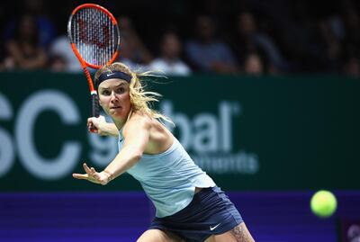 SINGAPORE - OCTOBER 27:  Elina Svitolina of Ukraine plays a forehand in her singles match against Simona Halep of Romania during day 6 of the BNP Paribas WTA Finals Singapore presented by SC Global at Singapore Sports Hub on October 27, 2017 in Singapore.  (Photo by Clive Brunskill/Getty Images)