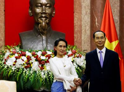 Myanmar's State Counsellor Aung San Suu Kyi (L) meets Vietnam's President Tran Dai Quang at the Presidential Palace during the World Economic Forum on ASEAN in Hanoi, Vietnam September 13, 2018. REUTERS/Kham/Pool