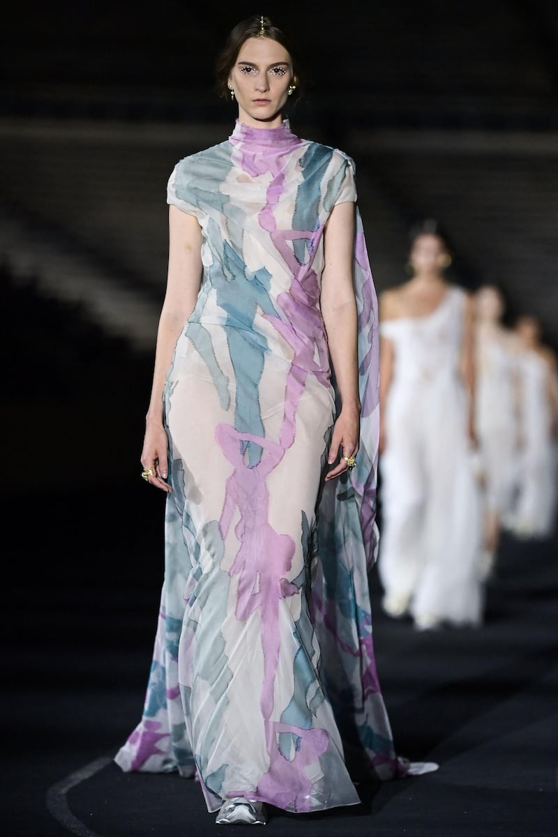 A model walks the runway during the Dior Cruise show 2022 at Panathenaic Stadium on June 17, 2021 in Athens, Greece. AFP