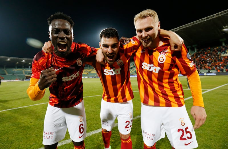 Galatasaray's Davinson Sanchez, Kaan Ayhan and Victor Nelsson celebrate winning the Turkish Super Cup final after the match was abandoned. Reuters