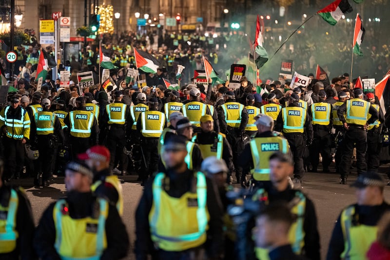 Police officers separate groups and disperse crowds at a protest against the Israel-Gaza war. Photo: Richard Baker