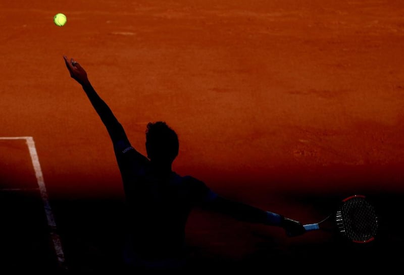 Argentina’s Renzo Olivo serves to homecrowd favourite Jo-Wilfried Tsonga at the French Open in Paris.  Tatyana Zenkovich / EPA