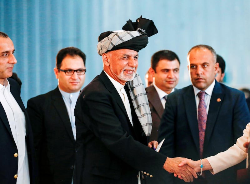 Afghan presidential candidate Ashraf Ghani arrives to cast his vote in the presidential election in Kabul. Reuters