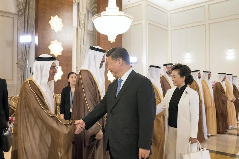 ABU DHABI, UNITED ARAB EMIRATES - July 19, 2018: HE Zaki Anwar Nusseibeh, (L) greets HE Xi Jinping, President of China (2nd L), during a reception held at the Presidential Airport. Seen with Peng Liyuan, First Lady of China (R).

( Mohamed Al Hammadi / Crown Prince Court - Abu Dhabi )
---