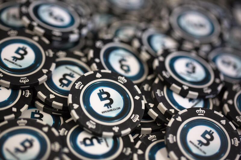 Casino gambling chips decorated with bitcoin logos sit on display at the CrytoSpace conference in Moscow, Russia, on Friday, Dec. 8, 2017. CryptoSpace is Eastern Europe's largest conference dedicated to blockchain technology and cryptocurrencies and runs Dec. 8-9. Photographer: Andrey Rudakov/Bloomberg