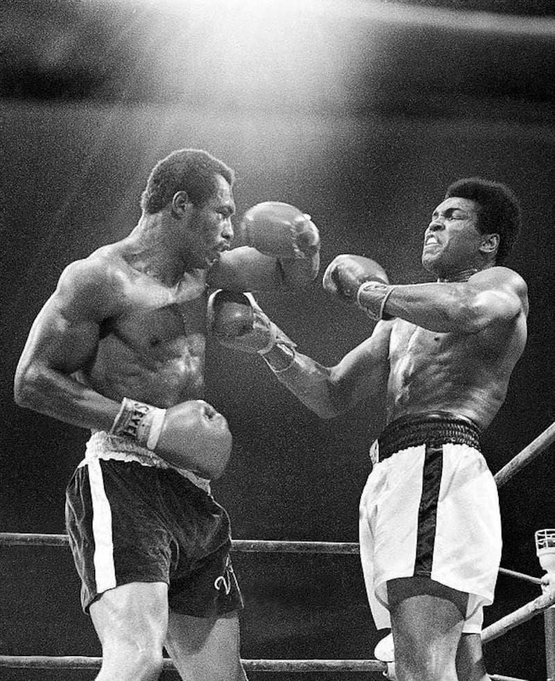 Muhammad Ali, right, winces as Ken Norton hits him with a left to the head during their re-match at the Forum in Inglewood, California. AP Photo