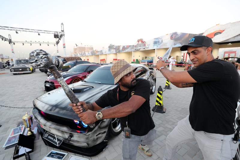 Waseem, left, and Junaid with their Dodge Challenger.