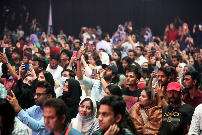 Fans, some of whom were waiting for the star since 12pm, take photos of Khan at the Sharjah International Book Fair.