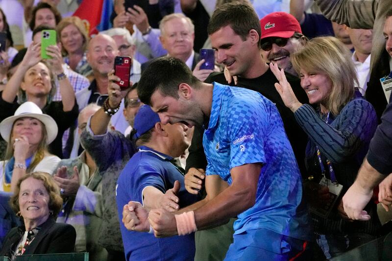 Novak Djokovic celebrates in the stands. AP 