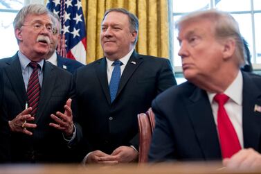 From left, former National Security Adviser John Bolton, Secretary of State Mike Pompeo and President Donald Trump. AP
