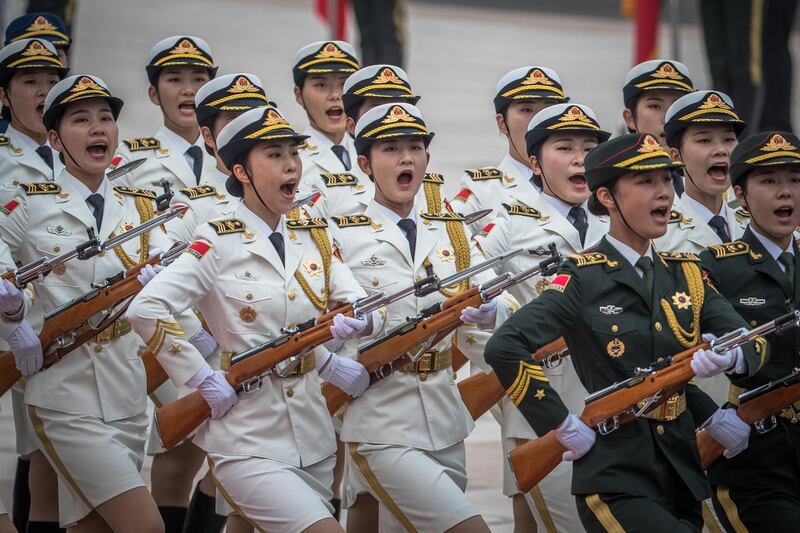 Members of a Chinese honour guard guard march during a welcome ceremony for Sheikh Mohamed bin Zayed at the Great Hall of the People in Beijing.  Ramona Pilipey / EPA