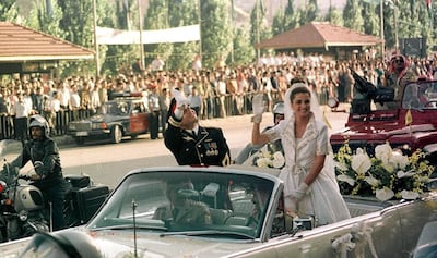 Queen Rania of Jordan waves to the crowds on her wedding day to King Abdullah II in 1993. Reuters