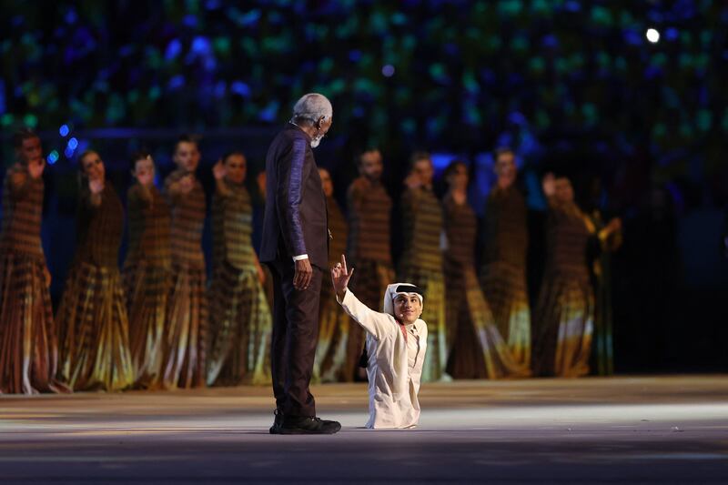 Qatari motivational speaker and social media influencer Ghanim Al Muftah shares the stage with Hollywood star Morgan Freeman at the opening ceremony of the Qatar 2022 World Cup. AFP