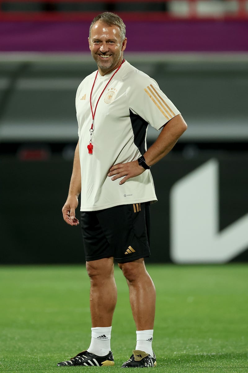 Germany coach Hansi Flick smiles during the training session at Al Shamal Stadium. Getty