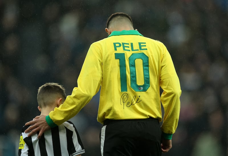 Newcastle midfielder Bruno Guimaraes wearing a Brazil shirt brfore the game in tribute to Brazilian football hero Pele who died on Thursday. Reuters