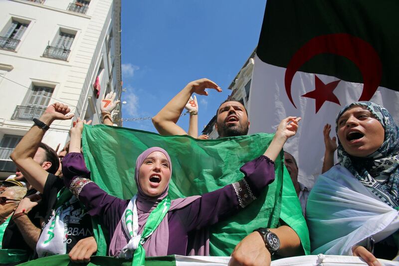 Demonstrators gesture and shout slogans during a protest demanding social and economic reforms, as well as the departure of the country's ruling elite in Algiers, Algeria. Reuters