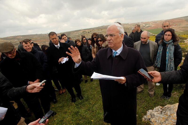 Palestinian chief negotiator Saeb Erekat gestures as he speaks to foreign diplomats during a tour near Jewish settlements in the West Bank village of Jaloud near Nablus on March 16, 2017. Reuters