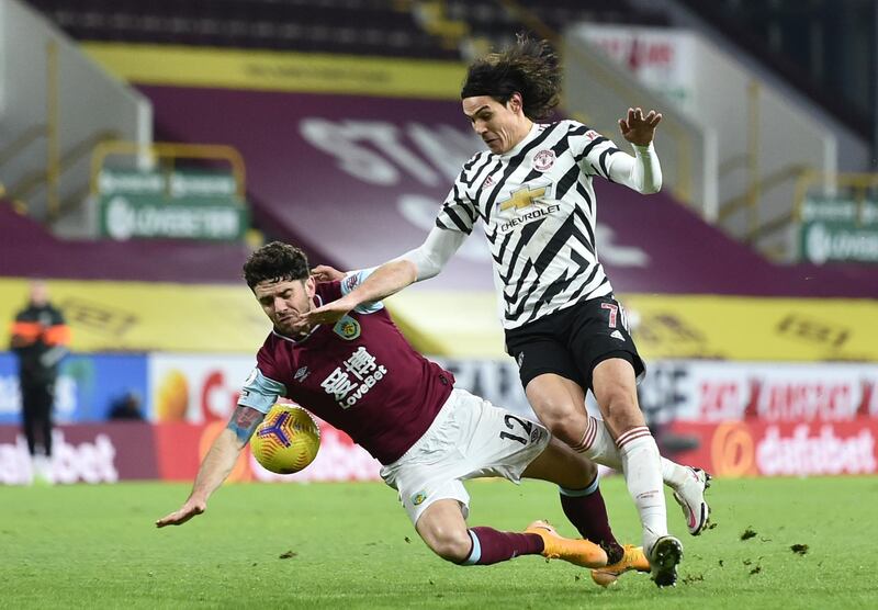 Manchester United's Edinson Cavani fights for the ball with Burnley's Robbie Brady. AP