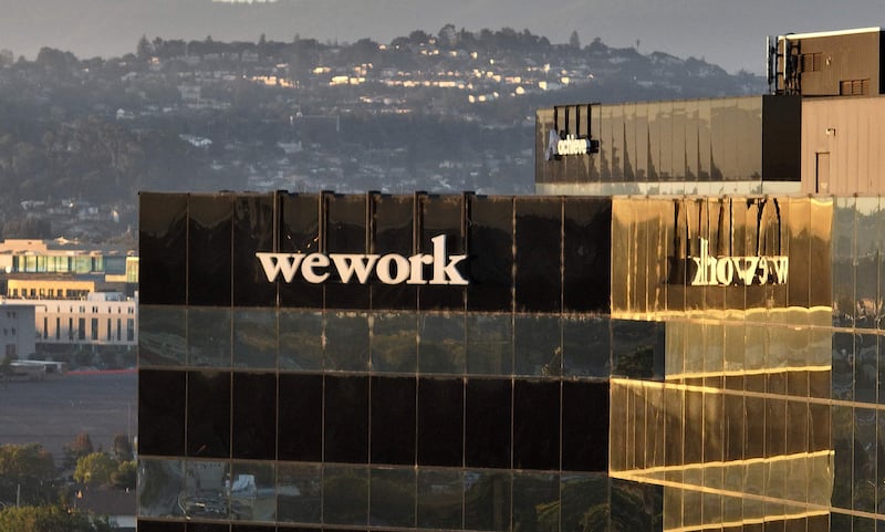 WeWork aimed to revolutionise the office market by taking long leases on large properties and renting the space to multiple smaller businesses. AFP