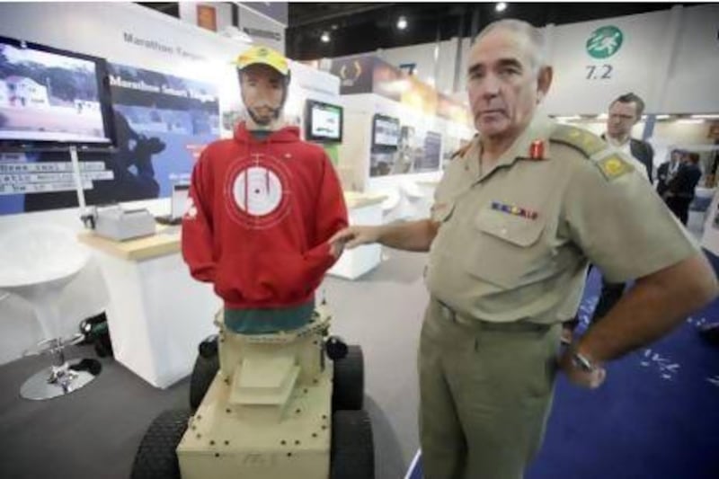 Australia’s Major General Mick Fairweather displays an automated target dummy during Idex. Sammy Dallal / The National
