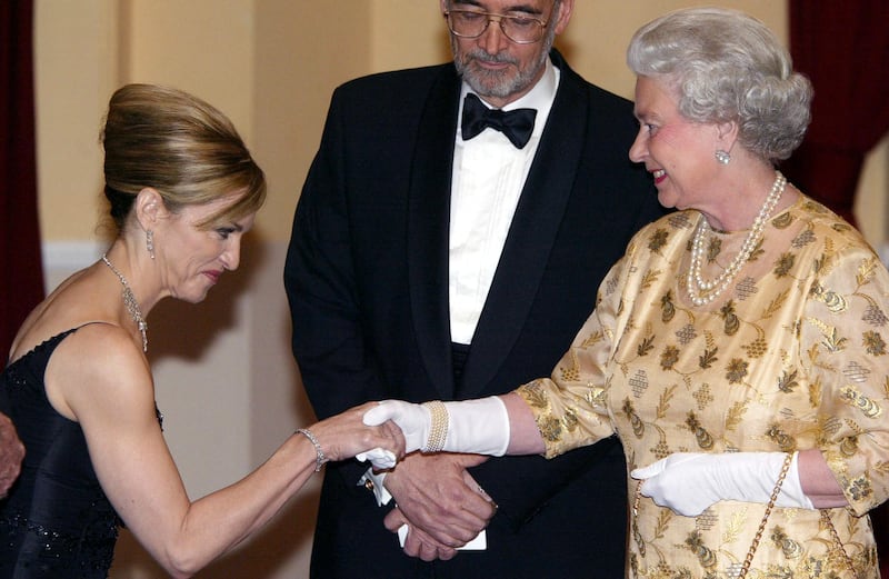 Queen Elizabeth II meets US pop star and actress Madonna, at the world premiere of the movie Die Another Day, at the Royal Albert Hall, on November 18, 2002, in London. AFP