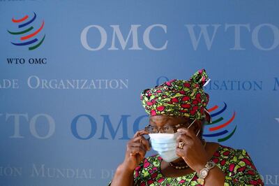 World Trade Organisation (WTO) Director-General Ngozi Okonjo-Iweala wears a facemask during the visit of Tunisian Prime Minister to the WTO buildings on June 9, 2021 in Geneva.  / AFP / Fabrice COFFRINI
