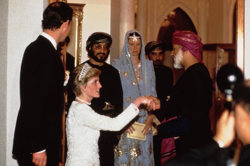 British royals Charles, then Prince of Wales, and his wife Princess Diana greet Sultan Qaboos bin Said of Oman at Al Alam Palace in Muscat, Oman, on November 11, 1986. Getty Images