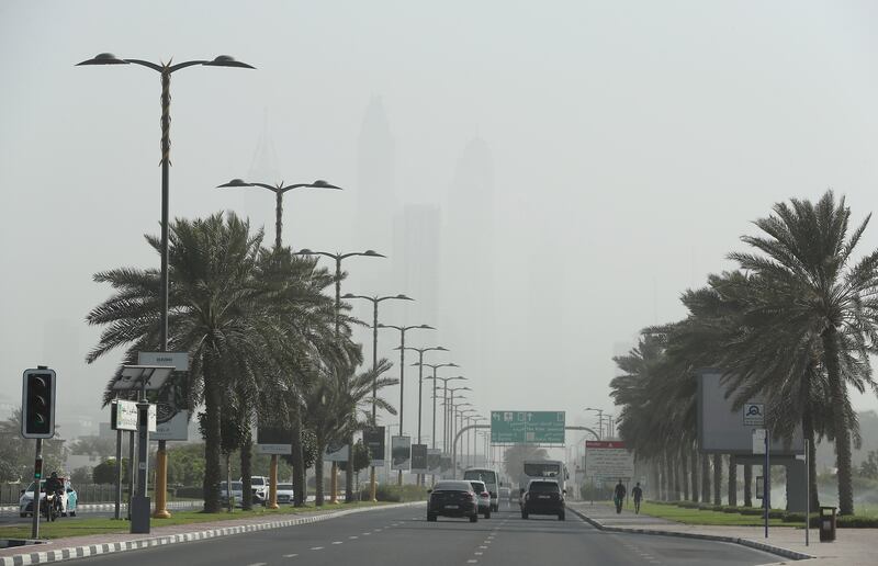 Towers in Dubai Marina are hard to see through the dust. Pawan Singh / The National