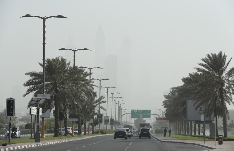 Towers in Dubai Marina silhouetted during the dust storm. Pawan Singh / The National