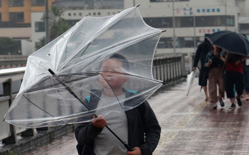 A boy holds an umbrella as he crosses a bridge at Enoshima island in Fujisawa, near Tokyo. Shizuo Kambayashi / AP Photo