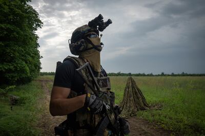 A Ukrainian soldier scanning the sky for Russian drones on the front line in Zaporizhzhia region. AP