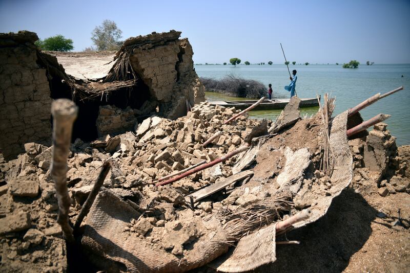 A home damaged by floodwaters in Sehwan, Sindh province. AP