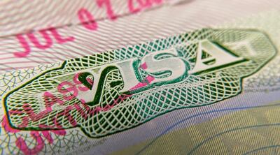 This photo illustration shows a visa stamp on a foreign passport in Los Angeles on June 6, 2020. The United States said June 6 it would not allow foreign students to remain in the country if all of their classes are moved online in the fall over the coronavirus crisis. / AFP / Chris DELMAS
