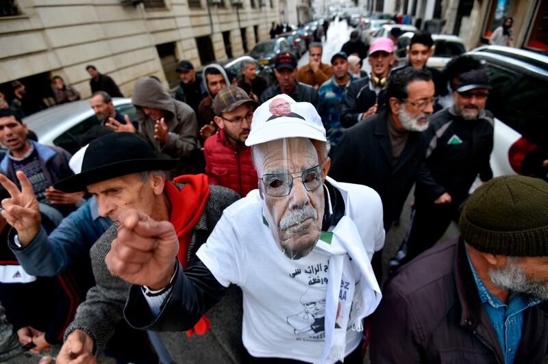 Algerians chant slogans during a demonstration. AFP