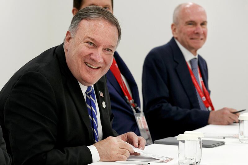 FILE PHOTO: Secretary of State Mike Pompeo, left, sits down for a meeting with Japanese Foreign Minister Taro Kono, in Osaka, Japan, Friday, June 28, 2019, during the G-20 summit. At right is the secretary's senior adviser Michael McKinley. Jacquelyn Martin/Pool via REUTERS/File Photo