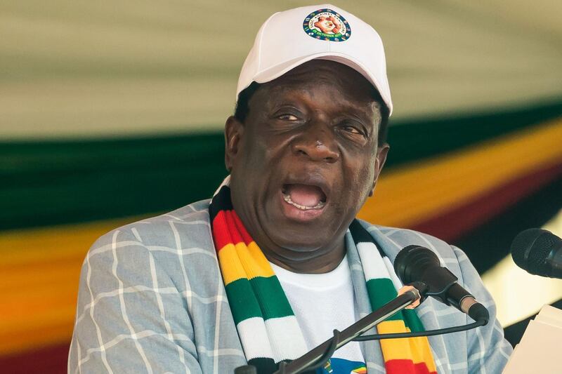 Zimbabwe president Emmerson Mnangagwa delivers a speech on stage during a rally to denounce US and EU economic sanctions against Zimbabwe at the National Stadium, in the capital Harare, October 25, 2019.  Zimbabweans staged a mass protest on October 25, 2019 against sanctions imposed by the US and the European Union during the despotic rule of late ex-leader Robert Mugabe. President Emmerson Mnangagwa has been battling to re-engage with the West since Mugabe was ousted by the military in November 2017.
 / AFP / Jekesai NJIKIZANA
