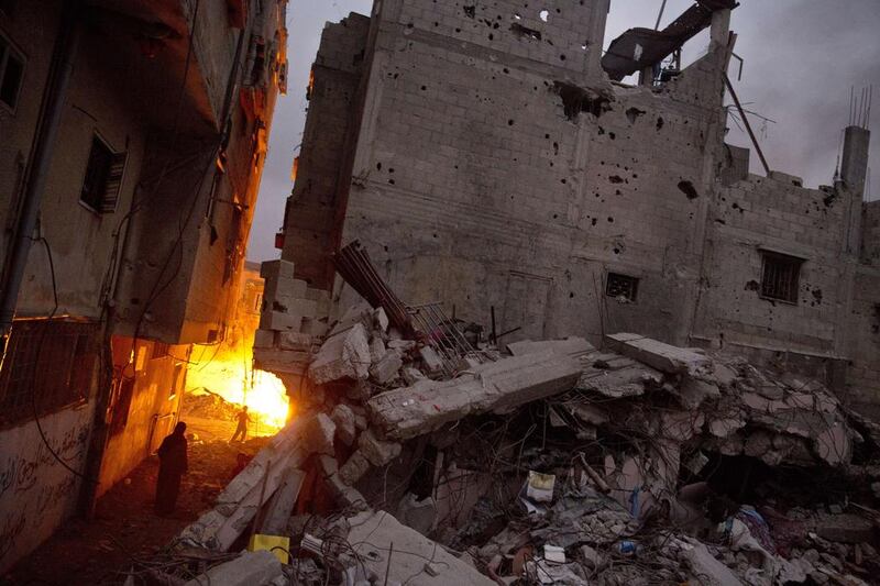 The rubble of homes that were destroyed by the Israeli military during an offensive that killed over 2,100 Palestinians and displaced hundreds of thousands. (AFP/Roberto Schmidt)