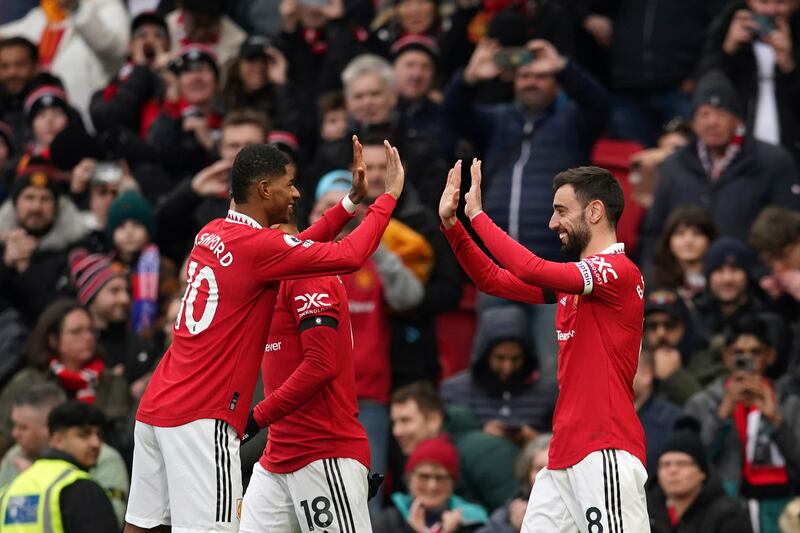 Manchester United's Bruno Fernandes celebrates with teammates after scoring the opening goal. AP