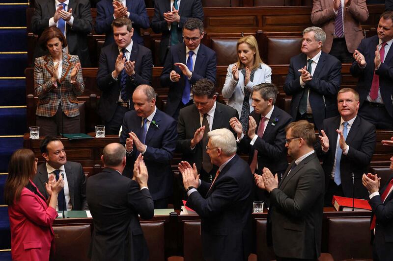 Ireland's departing Prime Minister Leo Varadkar, bottom left, receiving a round of applause after speaking in the Dail in Dublin. AFP