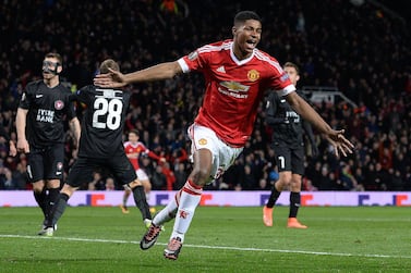 Manchester United's English striker Marcus Rashford celebrates scoring his team's third goal during the UEFA Europa League round of 32, second leg football match between Manchester United and and FC Midtjylland at Old Trafford in Manchester, north west England, on February 25, 2016. (Photo by OLI SCARFF / AFP)