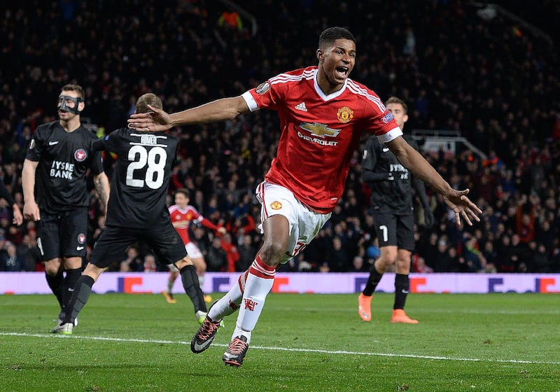 Manchester United's English striker Marcus Rashford celebrates scoring his team's third goal during the UEFA Europa League round of 32, second leg football match between Manchester United and and FC Midtjylland at Old Trafford in Manchester, north west England, on February 25, 2016. (Photo by OLI SCARFF / AFP)