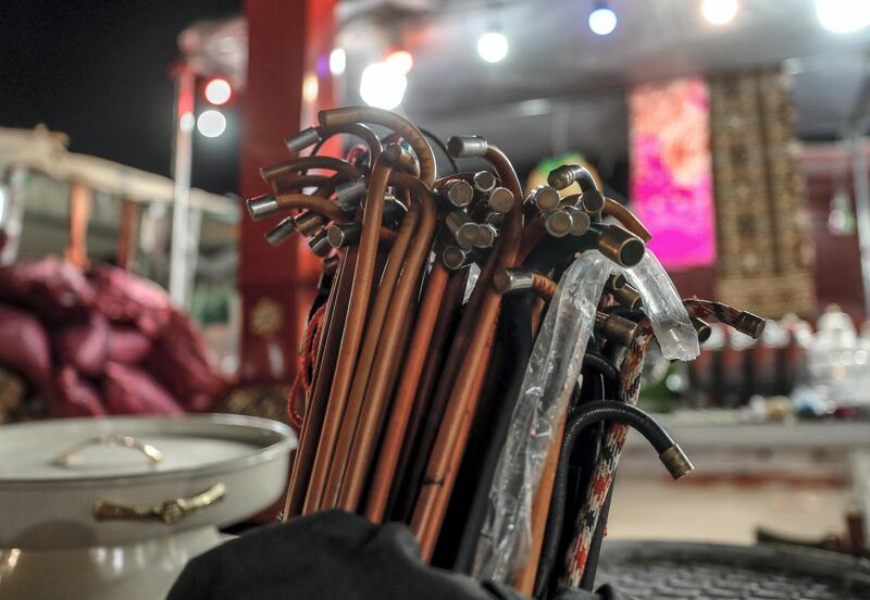 Abu Dhabi, United Arab Emirates, December 10, 2019.  
  -- Camel sticks for sale at a makeshift market on Million Street at the Al Dhafra Festival, Abu Dhabi.
Victor Besa/The National
Section:  NA
Reporter:  Anna Zacharias