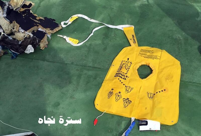 This picture, one of several posted to the official Facebook page of the Egyptian armed forces spokesman on Saturday, shows a life vest from EgyptAir flight 804. The Arabic reads: "Life vest". Egyptian Armed Forces via AP