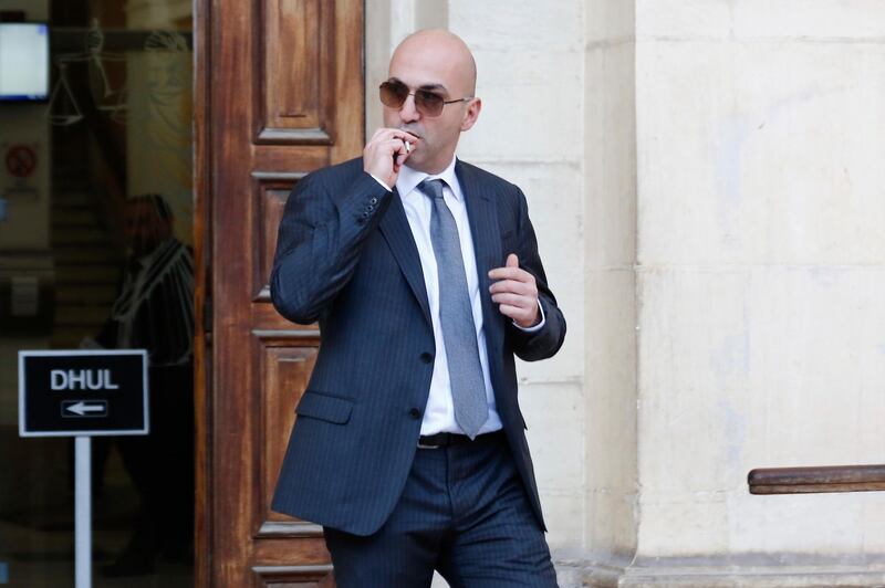 Maltese businessman Yorgen Fenech, who was taken into custody by police last week as he was trying to flee the island, leaves court after being questioned in the 2017 bomb blast that killed investigative journalist Daphne Caruana Galizia as she drove near her home, in Valletta, Malta, Friday, Nov. 29. 2019. (AP Photo/str)