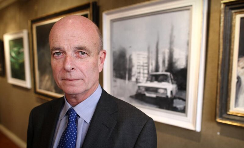 LONDON, ENGLAND - FEBRUARY 14:  The former head of MI6, Sir John Scarlett,stands in front of photographs displayed at  the 'A Year with MI6' exhibition at the Mount Street Gallery on February 14, 2011 in London, England. As part of the centenary celebrations of the United Kingdom's Secret Intelligence Sevice, also known as MI6, artist James Hart Dyke was invited to record their work in a series of paintings and sketches. The exhibition is open to the public from 15th to 27th February 2011.  (Photo by Peter Macdiarmid/Getty Images)
