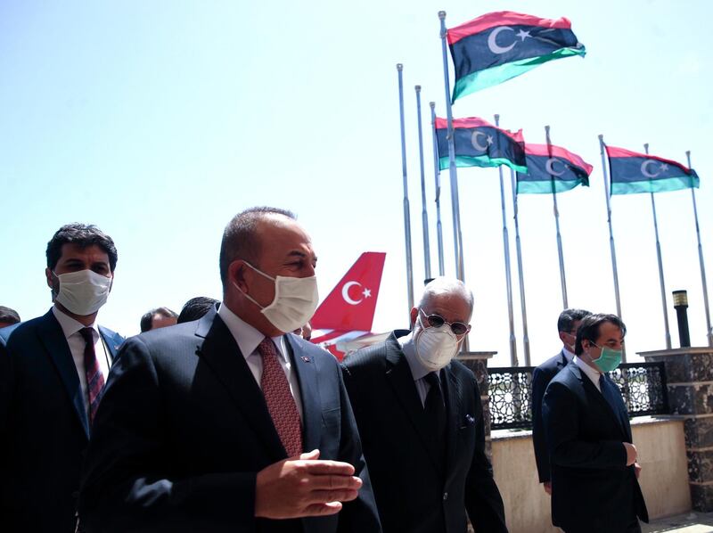 FILE - In this June 17, 2020, file photo, Turkey's Foreign Minister Mevlut Cavusoglu, left, and Muhammed Tahir Siyala, Foreign Minister of Libya's internationally-recognized government, speak at the airport, in Tripoli, Libya. Libyaâ€™s eastern-based forces have lost the chance to engage in a political solution to the North African countryâ€™s conflict, Turkey's foreign minister said Saturday, June 20, 2020. (Fatih Aktas/Turkish Foreign Ministry via AP, Pool, File)