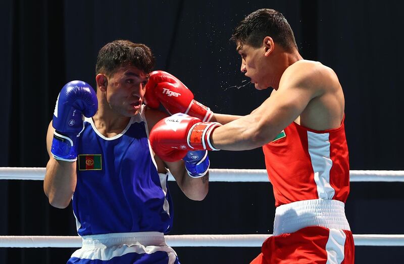 Jafarov Saidjamshid of Uzbekistan (red) catches Sulaiman of Afghanistan (blue) in the men's middleweight 75kg preliminary bout on day one of the Asian Boxing Championships. Getty Images