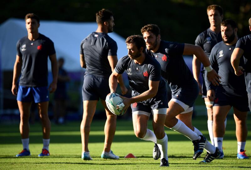 France's full back Maxime Medard runs with the ball during a training session. AFP