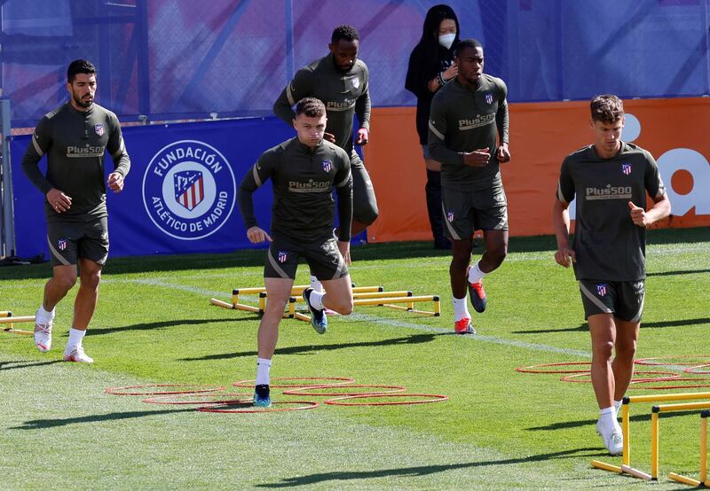 Atletico Madrid players Kieran Trippier and Luis Suarez attend their team's training session. EPA